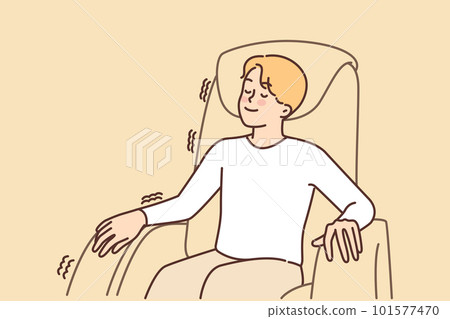 Man relaxed sitting in massage chair enjoying comfort and wellness treatments for spine and muscles 101577470