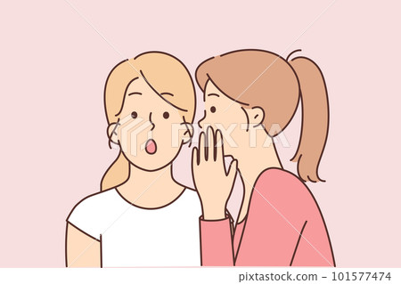 Two female friends gossip telling secrets in ears and discussing actions of work colleagues 101577474