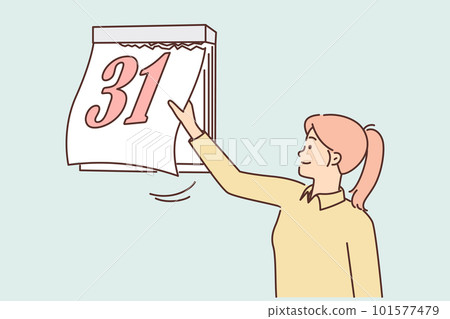 Woman tears off sheet of calendar with number 31 at end of month and beginning of new period 101577479