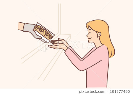 Hungry woman buys hot dog in fast food restaurant or street catering store with delicious sandwiches 101577490