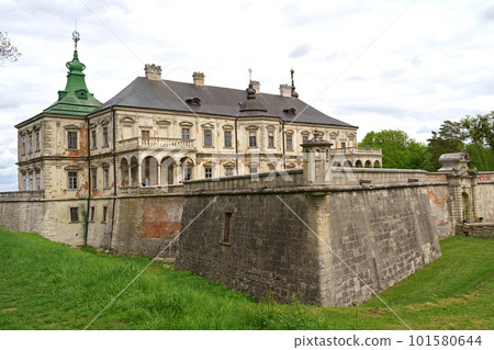 History of Ukraine. Tourism. Aerial view Tourists see old Pidhirtsi castle, near Lviv, Ukraine. Very beautiful castle near Lviv. May 2021 101580644