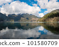 Aerial shot of beautiful alpine lake Ritsa speed boat floating summer, View from Above on Gorgeous Lake Ritsa 101580709