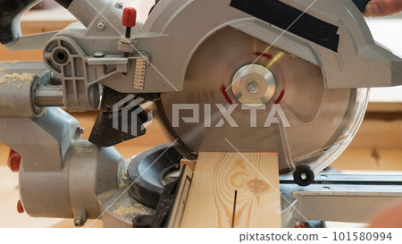 Close-up of a circular saw in a workshop. Close-up of a circular saw in a workshop. 101580994