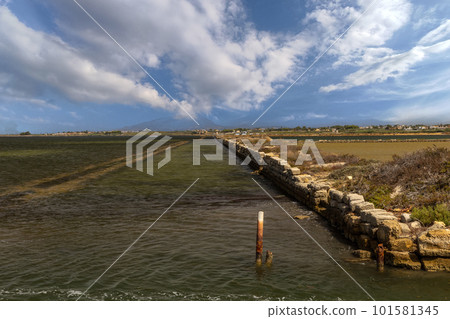 traditional salt pans and windmills 101581345