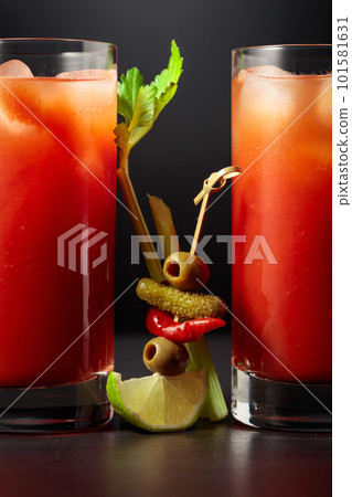 Cocktail Bloody Mary on a black background. Cocktail Bloody Mary on a black background. 101581631