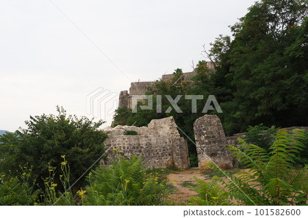 Fort Mezaluna Mesaluna Citadel Citadela Montenegro Herceg Novi. The ruins of an ancient stone fortress, destroyed in an earthquake, fell into the Adriatic Sea, the Mediterranean. Tourist attractions Fort Mezaluna Mesaluna Citadel Citadela Montenegro Herceg Novi. The ruins of an ancient stone fortress, destroyed in an earthquake, fell into the Adriatic Sea, the Mediterranean. Tourist attractions 101582600