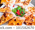 Pizza bread with arugula and tomatoes italian style, top view 101582670