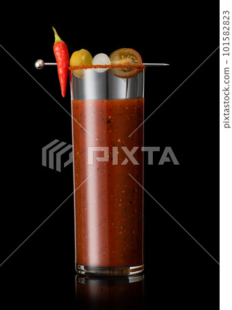 Bloody mary cocktail mix with black pepper and celery on black with onion and olive. Bloody mary cocktail mix with black pepper and celery on black with onion and olive. 101582823
