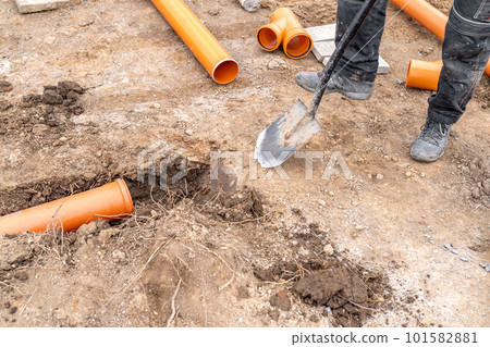 plastic pvc waste sewer pipe in the ground. construction site plastic pvc waste sewer pipe in the ground. construction site 101582881