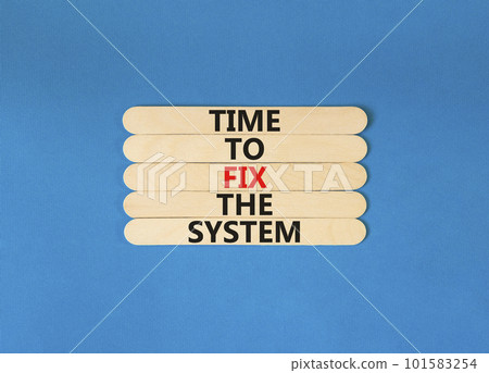 Time to fix the system symbol. Concept words Time to fix the system on wooden stick. Beautiful blue table blue background. Business and time to fix the system concept. Copy space. 101583254