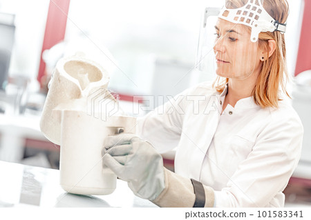 research with liquid nitrogen in the laboratory is carried out by a young female scientist with a protective glass face mask research with liquid nitrogen in the laboratory is carried out by a young female scientist with a protective glass face mask 101583341
