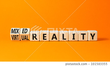 Mixed or virtual reality symbol. Concept words Mixed reality Virtual reality on wooden cubes. Beautiful orange table orange background. Business mixed or virtual reality concept. Copy space. 101583355
