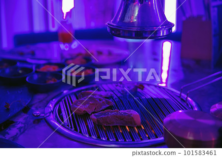 Sizzling Korean BBQ in the restaurant Sizzling Korean BBQ in the restaurant 101583461