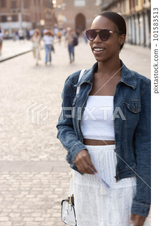 Portrait of turist woman dressed in white getting to know Europe, Ferrara. Italy Portrait of turist woman dressed in white getting to know Europe, Ferrara. Italy 101583513