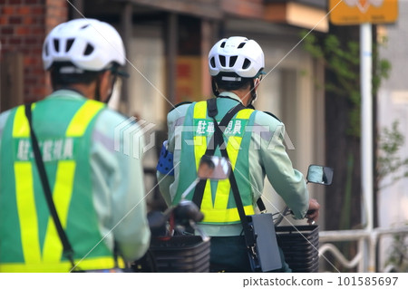 Parking warden moving by bicycle Parking warden moving by bicycle 101585697