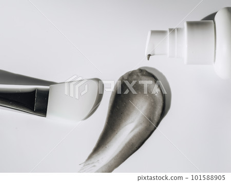 facial mask smeared from jar with dispenser with makeup brush on white background facial mask smeared from jar with dispenser with makeup brush on white background 101588905