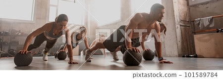 Team of young people training in gym club Team of young people training in gym club 101589784