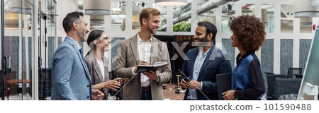 Multiethnic group of business people talking in office during break. Teamwork concept 101590488