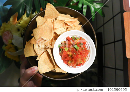 nachos, Nachos Cheese or Mexican snacks with tomato salad 101590695