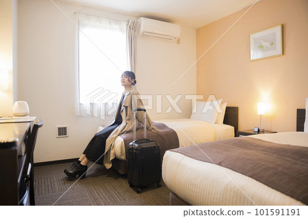 A young woman who checks in and arrives at her room Travel, business trip image A young woman who checks in and arrives at her room Travel, business trip image 101591191