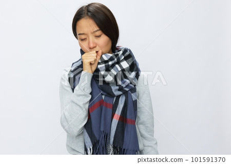 Asian woman cold flu raised hands from headache and toothache with fever sick from covid 19 virus in checkered scarf on white background, copy space Asian woman cold flu raised hands from headache and toothache with fever sick from covid 19 virus in checkered scarf on white background, copy space 101591370