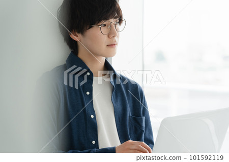 A young man heading to a computer 101592119