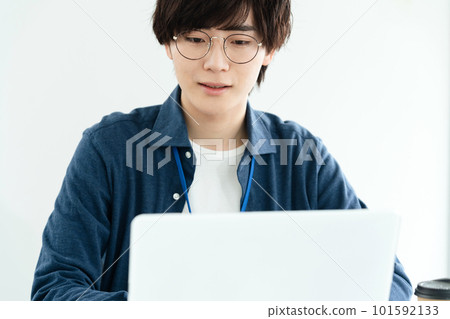 A young man heading to a computer 101592133