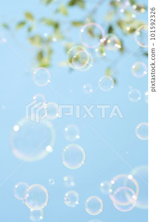 Soap bubbles dancing in the blue sky 101592326