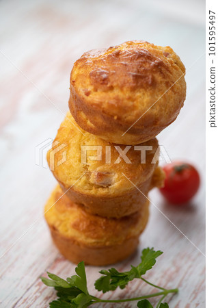 Savory muffin with ham and cheese on blue background 101595497