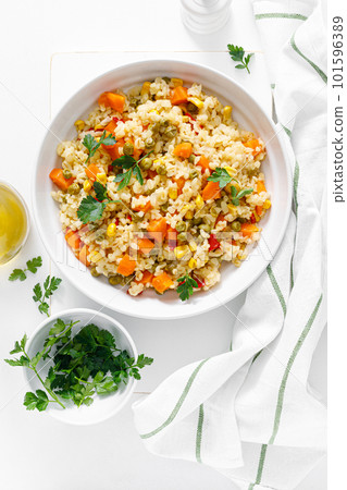 Bulgur with vegetables and fresh parsley 101596389
