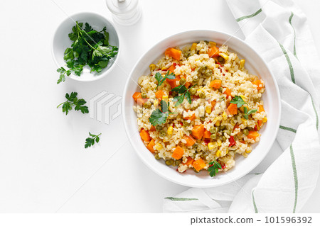 Bulgur with vegetables and fresh parsley 101596392