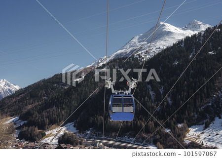 Cable car with snow mountains in background during winter vacation, winter holiday travel concept Cable car with snow mountains in background during winter vacation, winter holiday travel concept 101597067