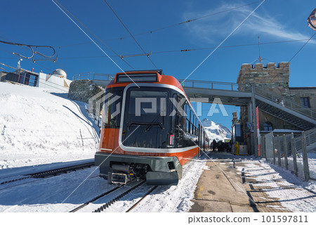 The train of Gonergratbahn running to the Gornergrat station and Stellarium Observatory - famous touristic place with clear view to Matterhorn. Glacier Express train. 101597811