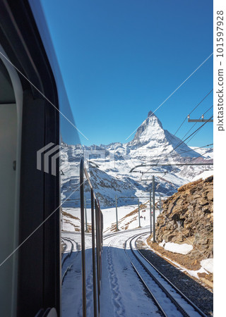 The train of Gonergratbahn running to the Gornergrat station and Stellarium Observatory - famous touristic place with clear view to Matterhorn. Glacier Express train. 101597928