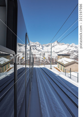 The train of Gonergratbahn running to the Gornergrat station and Stellarium Observatory - famous touristic place with clear view to Matterhorn. Glacier Express train. 101597986