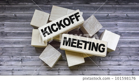 Kickoff meeting text on wooden blocks on wooden background .Money, business and finance concept Kickoff meeting text on wooden blocks on wooden background .Money, business and finance concept 101598176