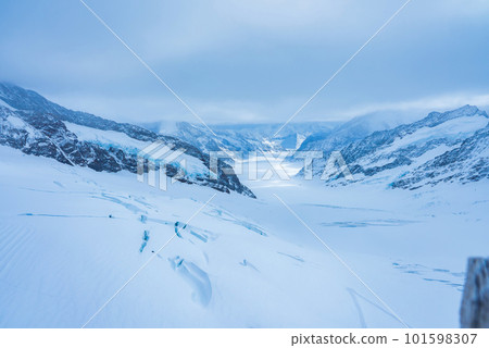 Magica view of the Alps mountains in Switzerland. View from helicopter in Swiss Alps. Mountain tops in snow. Breathtaking view of Jungfraujoch and the UNESCO World Heritage - the Aletsch Glacier 101598307