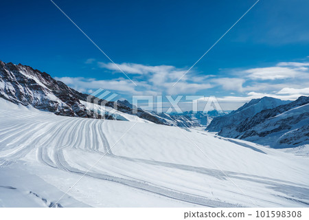 Magica view of the Alps mountains in Switzerland. View from helicopter in Swiss Alps. Mountain tops in snow. Breathtaking view of Jungfraujoch and the UNESCO World Heritage - the Aletsch Glacier Magica view of the Alps mountains in Switzerland. View from helicopter in Swiss Alps. Mountain tops in snow. Breathtaking view of Jungfraujoch and the UNESCO World Heritage - the Aletsch Glacier 101598308