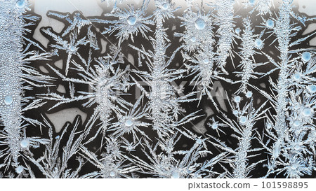 macro view of crystalline frost on window glass macro view of crystalline frost on window glass 101598895