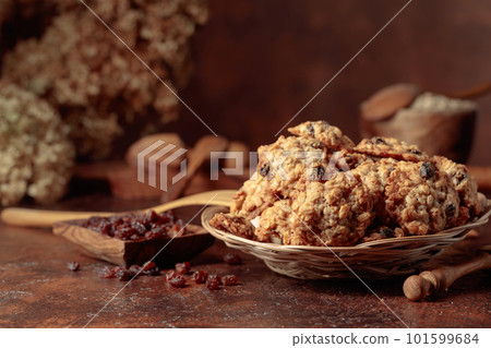 Oatmeal raisin cookies on a brown table. Oatmeal raisin cookies on a brown table. 101599684