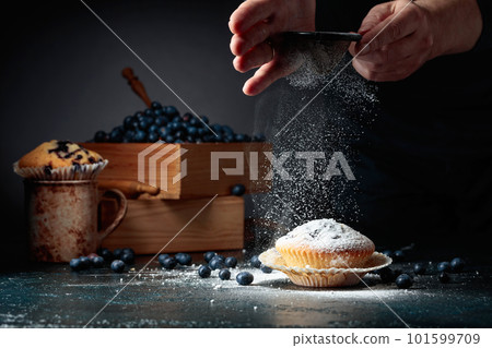 Blueberry muffins and fresh berries. 101599709