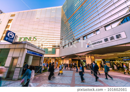 Yokohama cityscape in Japan 13th of yellow sand flying. Yellow-tinted glass windows and Yokohama Station… Masks increased = April 13 101602081