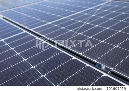 A group of solar panels from modern production for solar energy harvesting. A group of solar panels from modern production for solar energy harvesting. 101603959