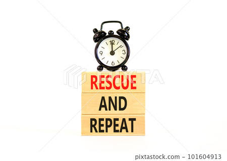 Rescue and repeat symbol. Concept words Rescue and repeat on wooden block on a beautiful white table white background. Black alarm clock. Business rescue and repeat concept. Copy space. 101604913