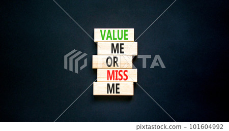 Value or miss me symbol. Concept words Value me or miss me on wooden block. Beautiful black table black background. Business psychological and value or miss me concept. Copy space. 101604992