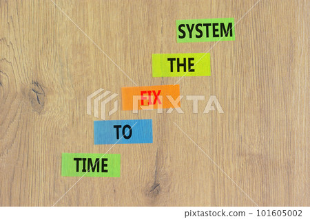 Time to fix the system symbol. Concept words Time to fix the system on colored paper. Beautiful wooden table wooden background. Business and time to fix the system concept. Copy space. 101605002