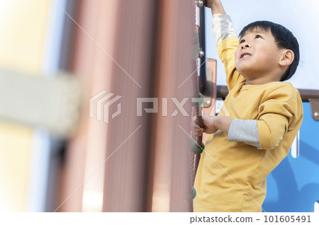 5 year old boy playing in the park 101605491