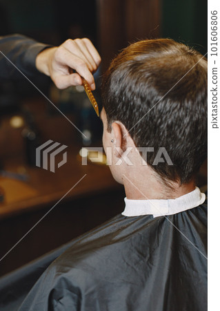 Man work with hair. Hairdresser with a client. Man work with hair. Hairdresser with a client. 101606806