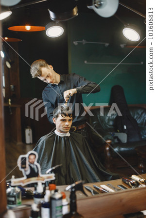 Man work with hair. Hairdresser with a client. 101606813