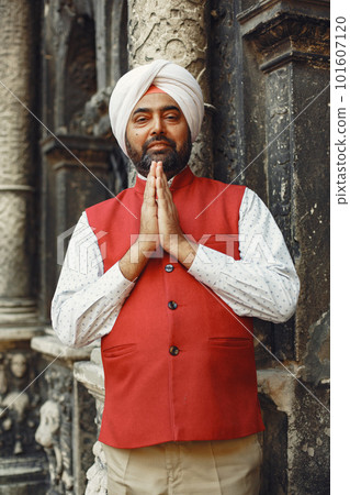 Indian man in a city. Male in a traditional turban. Hinduist in a summer city. Indian man in a city. Male in a traditional turban. Hinduist in a summer city. 101607120